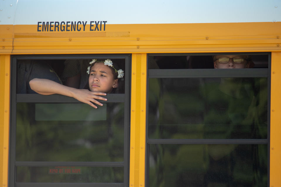 <p>Evacuated middle school students wait on a bus outside Noblesville High School after a shooting at Noblesville West Middle School on May 25, 2018 in Noblesville, Ind. (Photo: Kevin Moloney/Getty Images) </p>