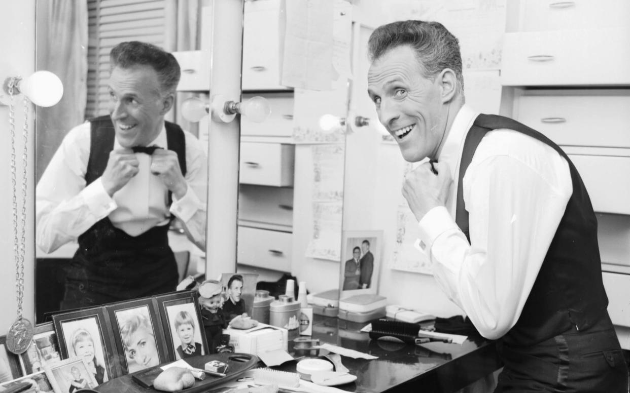 Television presenter and entertainer Bruce Forsyth, getting ready in his dressing room, London, 1964 - Hulton Archive