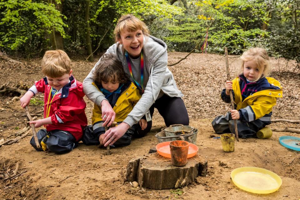 Fun in the open: manager Alice O'Reilly with children at Little Forest Folk's nursery on Wimbledon Common: Alex Lentati