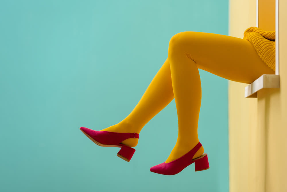 A woman wearing quirky, patterned tights with the shapes of leaves and  flowers on them Stock Photo - Alamy