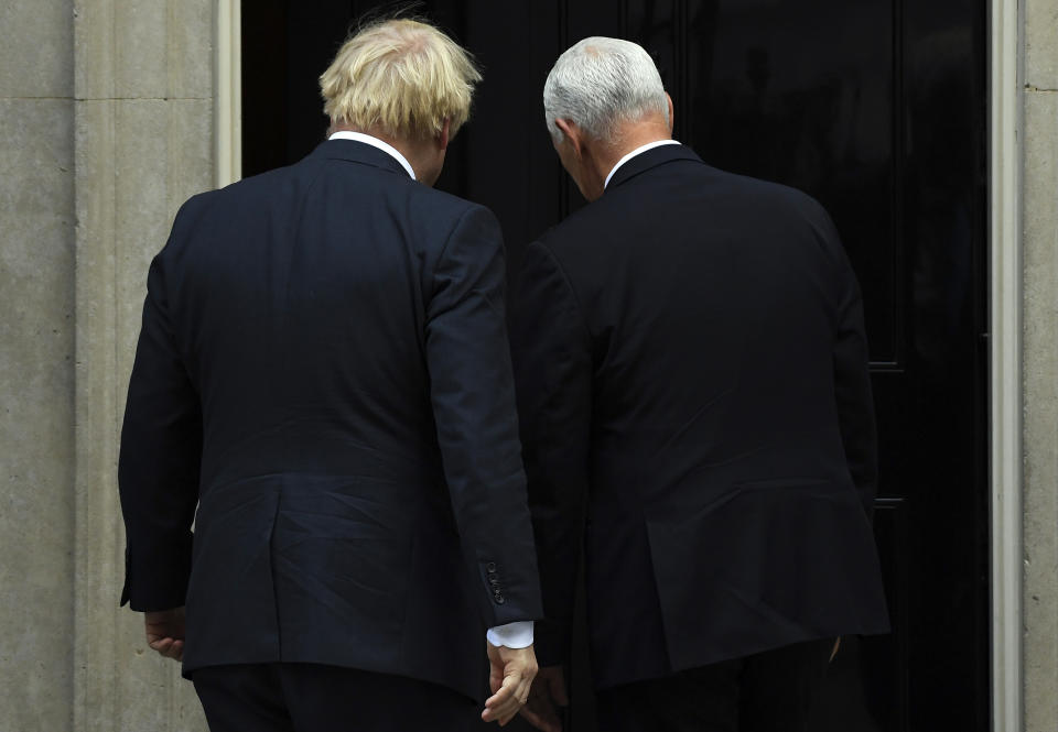 Britain's Prime Minister Boris Johnson, left, greets US Vice President Mike Pence on the doorstep of 10 Downing Street, in London, Thursday, Sept. 5, 2019.(AP Photo/Alberto Pezzali)