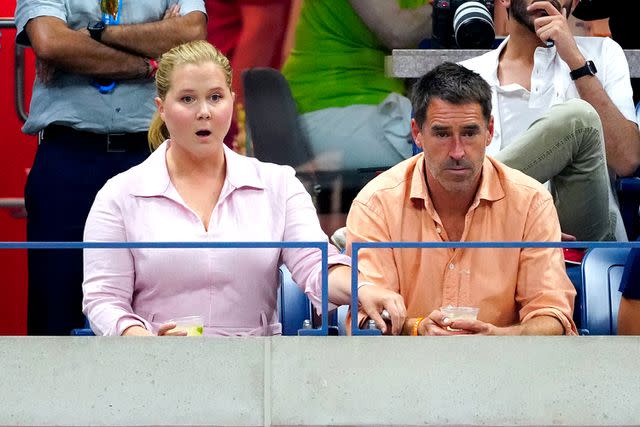 <p>Gotham/GC</p> Amy Schumer and Chris Fischer are seen at the 2023 US Open Tennis Championships on September 08, 2023 in New York City.