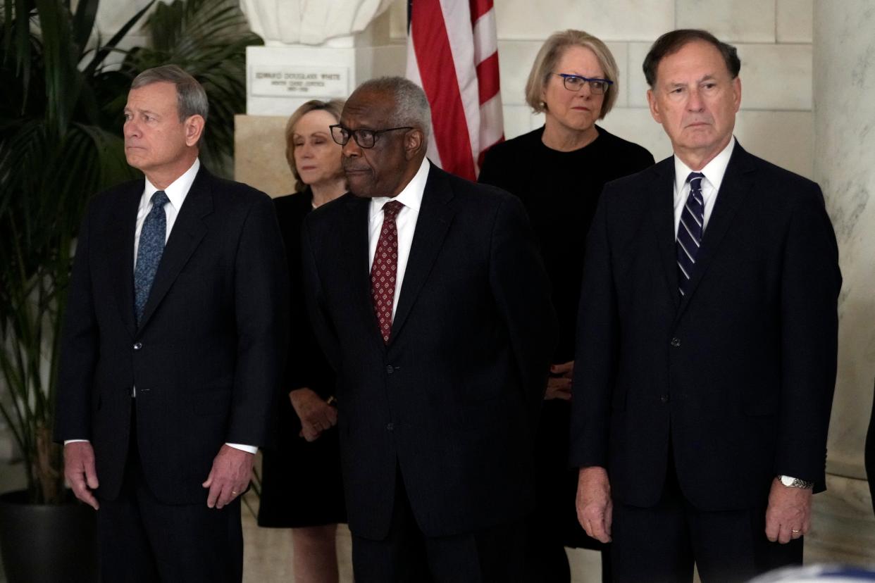 Chief Justice of the United States John Roberts, Justice Clarence Thomas and Justice Samuel Alito attend a private ceremony for retired Supreme Court Justice Sandra Day O'Connor before public repose in the Great Hall at the Supreme Court in Washington, DC, on Dec. 18, 2023.