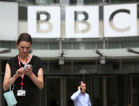 People stand outside Broadcasting House, the headquarters of the BBC, in London Britain July 2, 2015. REUTERS/Paul Hackett