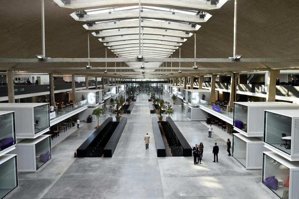 People visit the world's biggest start-up incubator Station F, Thursday June 29, 2017 in Paris. Station F was inaugurated by French President Emmanuel Macron, and is the only startup campus gathering a whole entrepreneurial ecosystem under one roof. (Bertrand Guay, Pool photo via AP)