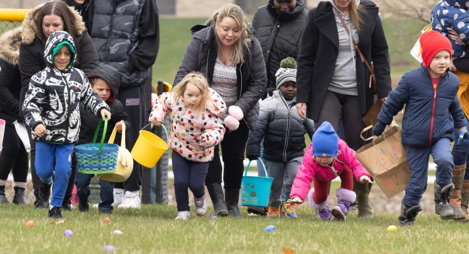 Children head out in search of plastic eggs at the Jackson Township North Park Easter Egg Hunt.
