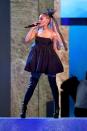 <p>Ari's favorite outfit formula works both on the stage and off. A mini babydoll dress is made fierce when paired with black leather thigh-high boots. </p>