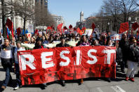 Protesters demonstrate against U.S. President Donald Trump and his plans to end Obamacare as they march to the White House in Washington, U.S., March 23, 2017. REUTERS/Kevin Lamarque