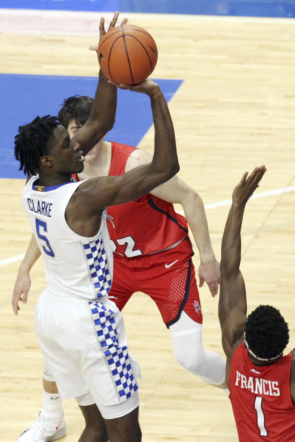 Kentucky's Terrence Clarke, left, shoots near Richmond's Blake Francis (1) during the second half of an NCAA college basketball game in Lexington, Ky., Sunday, Nov. 29, 2020. (AP Photo/James Crisp)