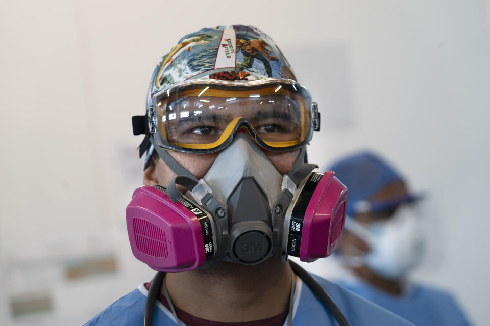 A health worker wears a protective mask and goggles at the Ajusco Medio General Hospital which is designated for COVID-19 cases only, in Mexico City, Tuesday, Aug. 31, 2021. (AP Photo/Marco Ugarte)