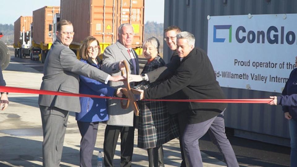 ConGlobal CEO Brandt Ring, Gov. Kate Brown, Linn County Commissioner Roger Nyquist, Oregon Transportation Commission member Julie Brown, ODOT director Kris Strickler and Union Pacific director of public affairs Aaron Hunt cut a ceremonial ribbon at the December 2022 grand opening of the Mid-Willamette Valley Intermodal Center.