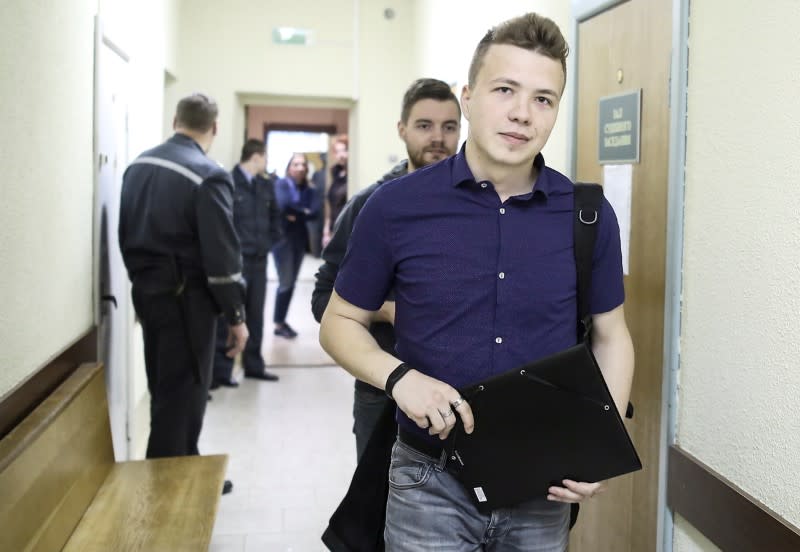 FILE PHOTO: Opposition blogger and activist Roman Protasevich arrives for a court hearing in Minsk