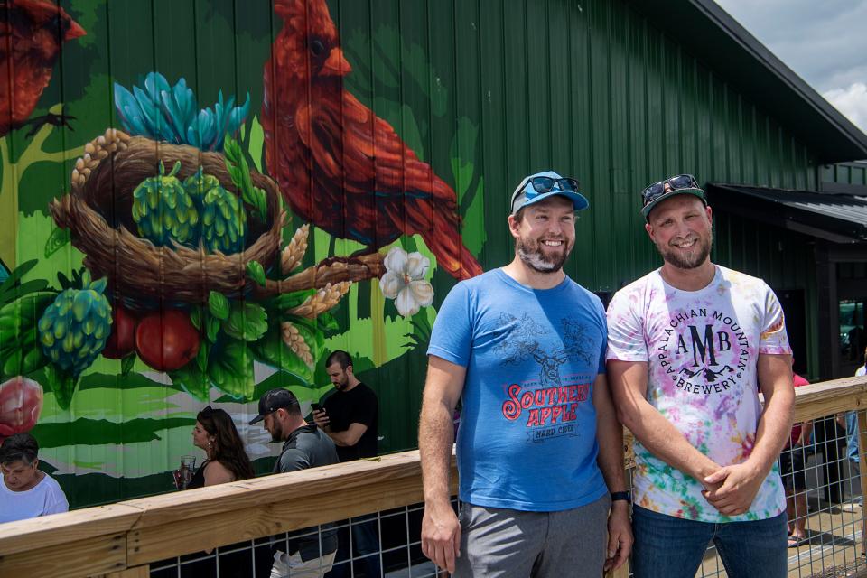 Chris Zieber, left, and Nathan Kelischek on their opening day at Appalachian Mountain Brewery June 23, 2023 in Mills River.