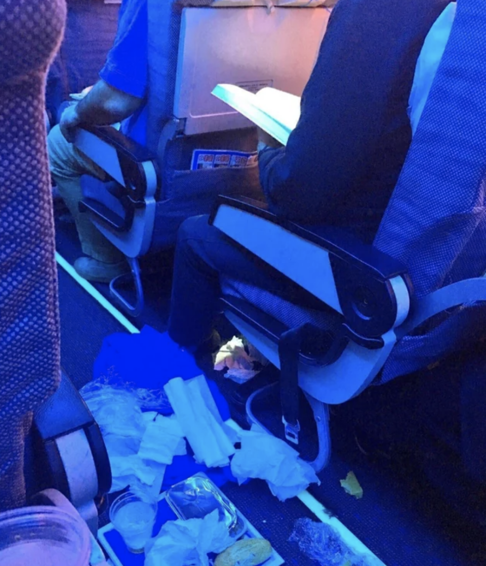 Trash in a plane aisle