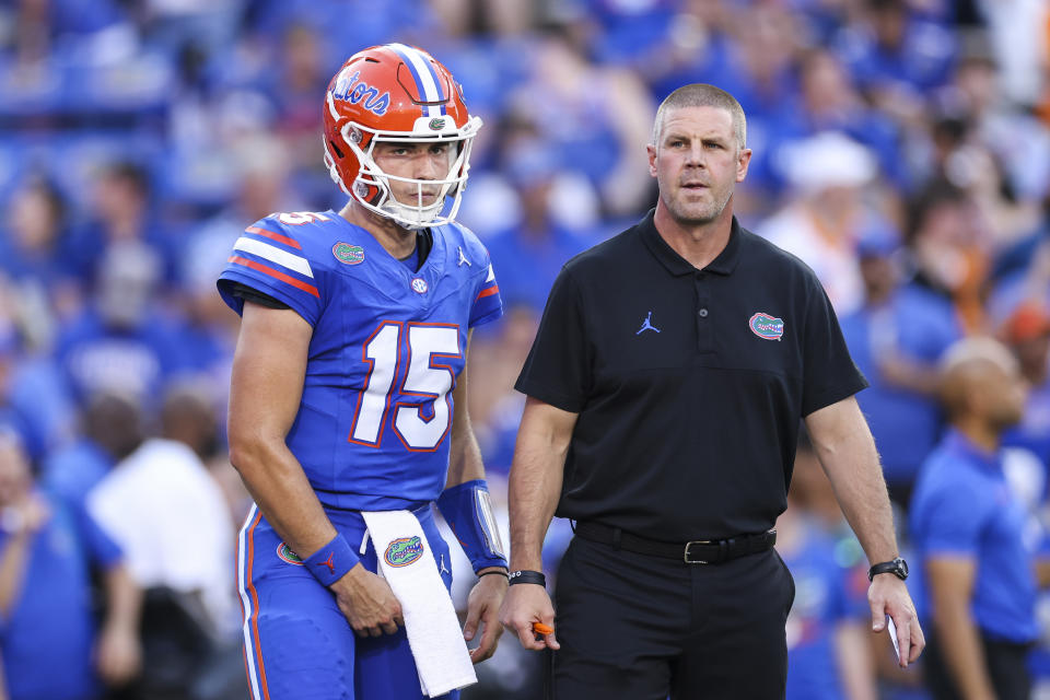 GAINESVILLE, FLORIDA - SEPTEMBER 16: Graham Mertz #15 of the Florida Gators and head coach Billy Napier look on before the start of a game against the Tennessee Volunteers at Ben Hill Griffin Stadium on September 16, 2023 in Gainesville, Florida. (Photo by James Gilbert/Getty Images)