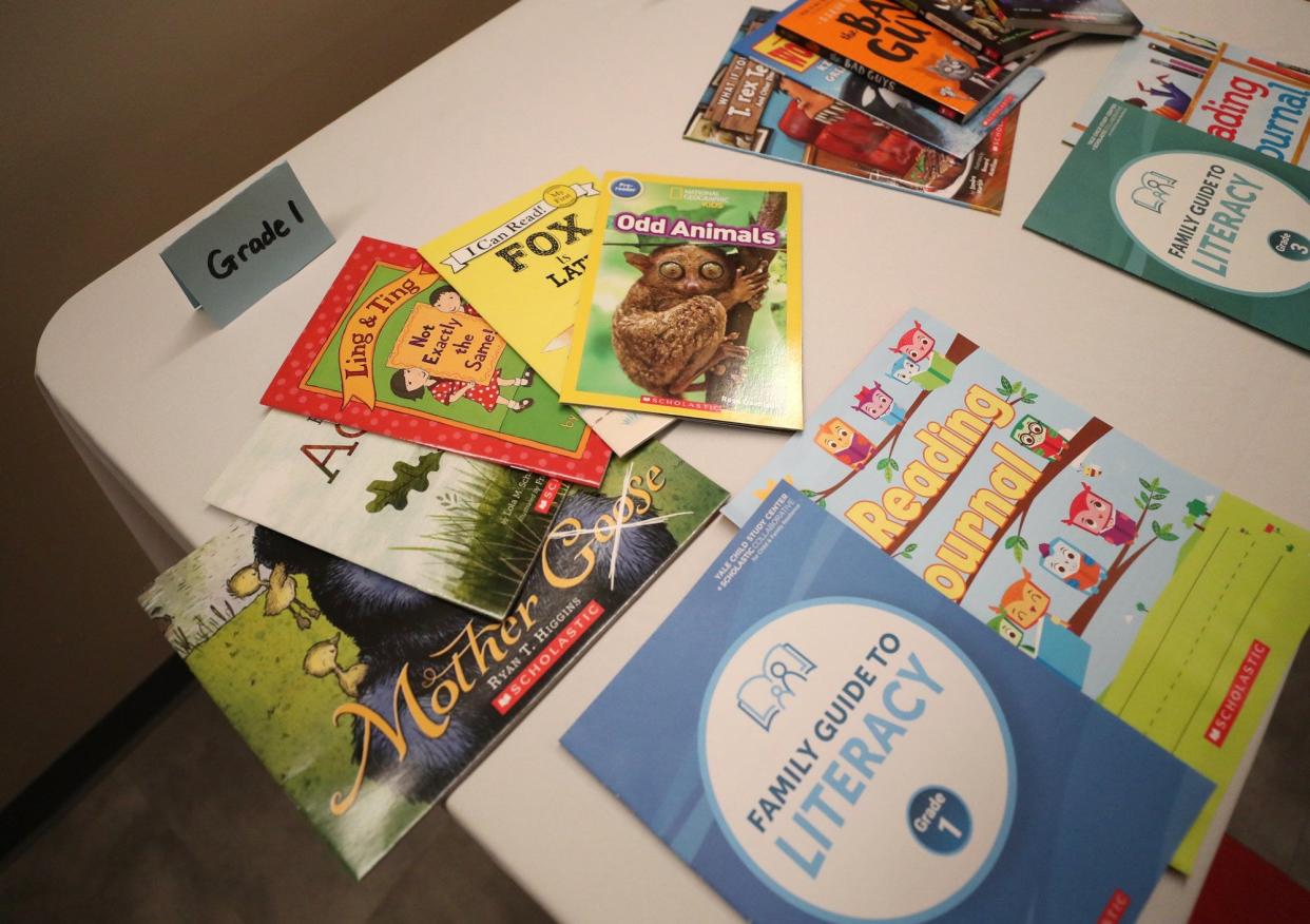 A display of the books that Akron Public Schools is purchasing with federal grant money this summer for students to build or expand their home library.