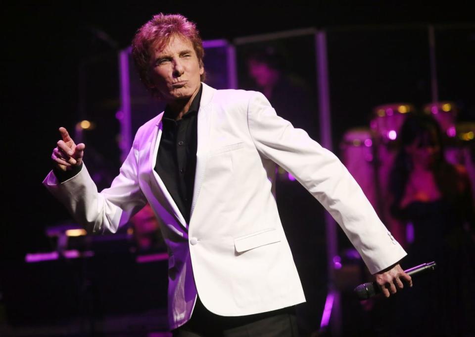 <div class="inline-image__caption"><p>Barry Manilow peforms during the curtain call of “Manilow On Broadway” in 2013. </p></div> <div class="inline-image__credit">Astrid Stawiarz/Getty</div>