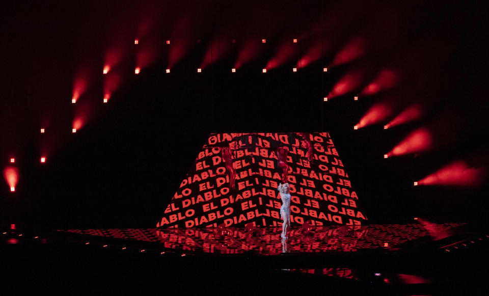 In this photo taken on May 12, 2021, Cyprus' performer Elena Tsagrinou rehearses her song El Diablo at the Eurovision Song Contest at Ahoy arena in Rotterdam, Netherlands. Tsagrinou has already been in the spotlight after Orthodox Christian faithful on the Mediterranean island protested that it promoted satanic worship. Tsagrinou says her song El Diabolo, which she performs flanked by four dancers in skin-tight red costumes, was misinterpreted and is actually about an abusive relationship between two lovers. (AP Photo/Peter Dejong)