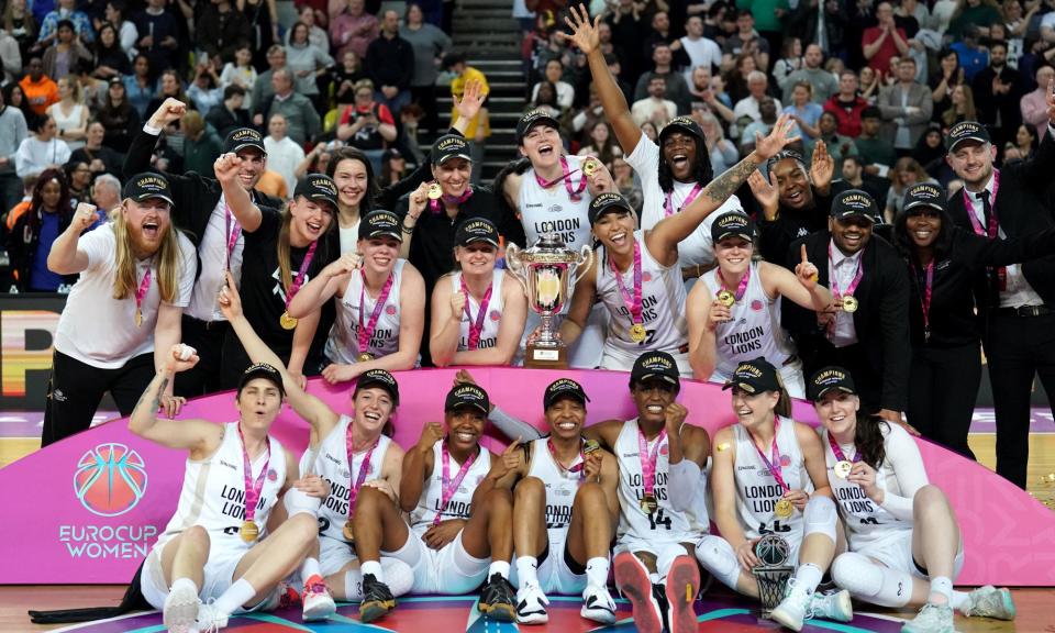 <span>London Lions celebrate with the EuroCup trophy after victory against Besiktas.</span><span>Photograph: Zac Goodwin/PA</span>