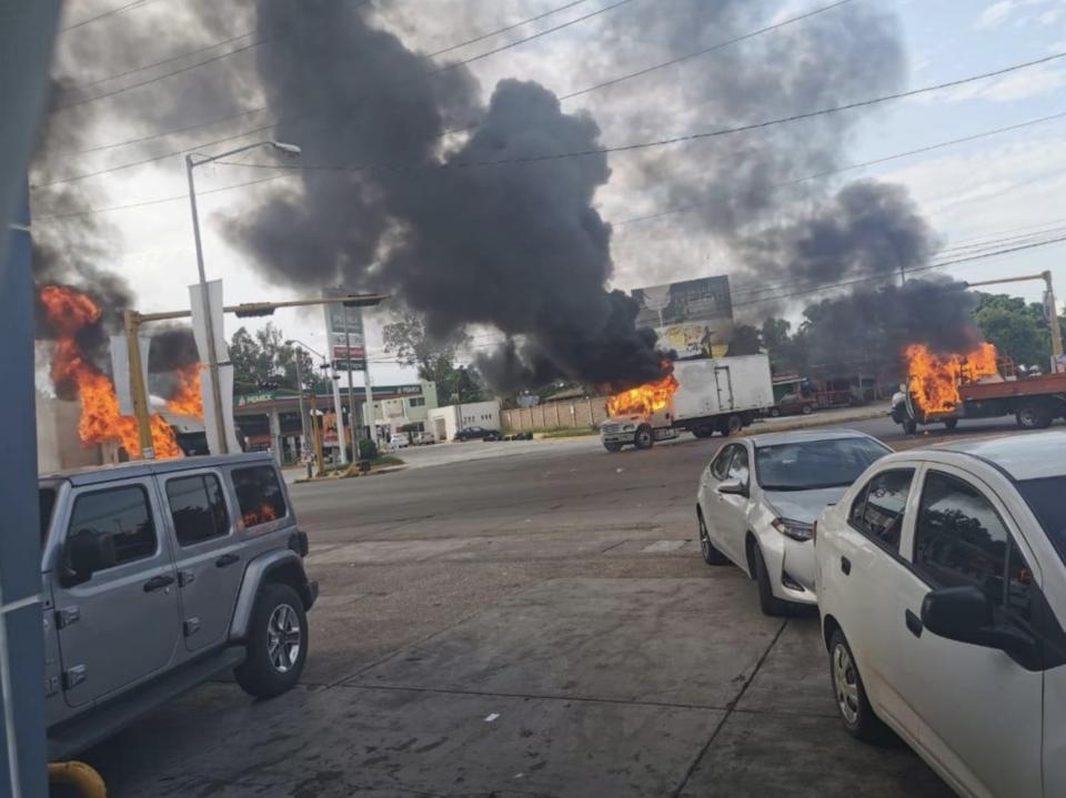 Multiple burning vehicles after an earlier firefight, in photo posted online. Source: Twitter