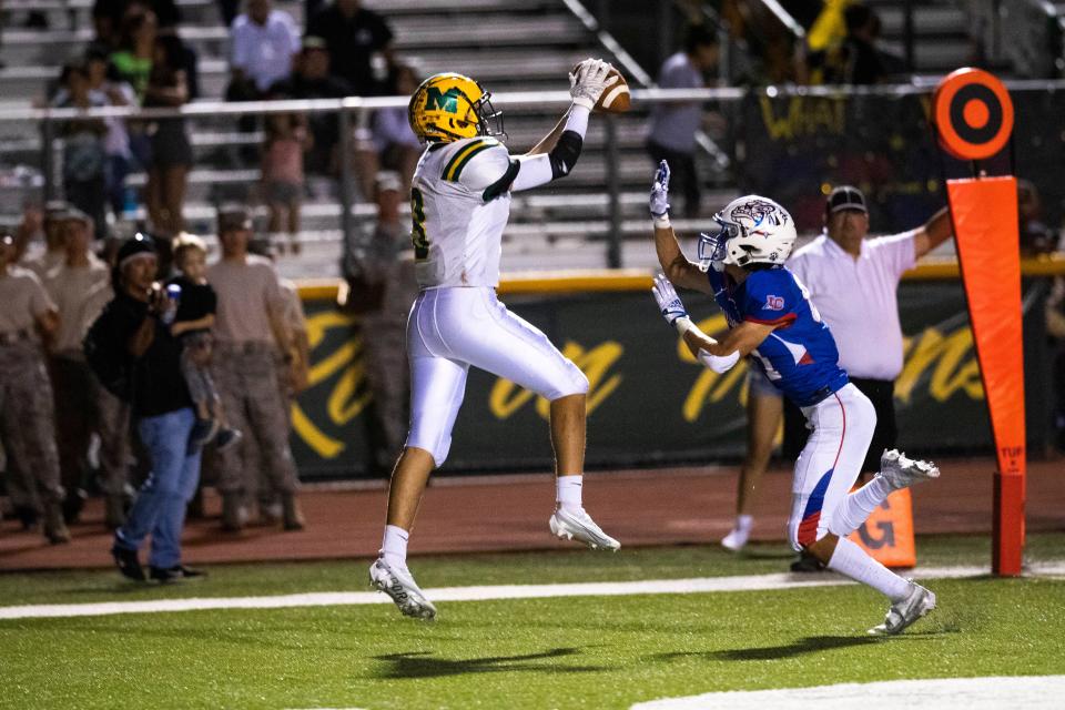 Mayfield's Brian Coyle scores a touchdown during the rival high school football game on Friday, Sept. 16, 2022, at the Field of Dreams.