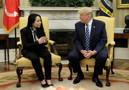 Aya Hijazi, an Egyptian-American woman detained in Egypt for nearly three years on human trafficking charges, meets with U.S. President Donald Trump in the Oval Office of the White House in Washington, U.S., April 21, 2017. REUTERS/Kevin Lamarque