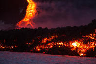 <p>Mount Etna, Europe’s most active volcano, spews lava during an eruption, near the Sicilian town of Catania, southern Italy, Tuesday, Feb. 28, 2017. (Marco Restivo/Barcroft Images/Barcroft Media via Getty Images) </p>