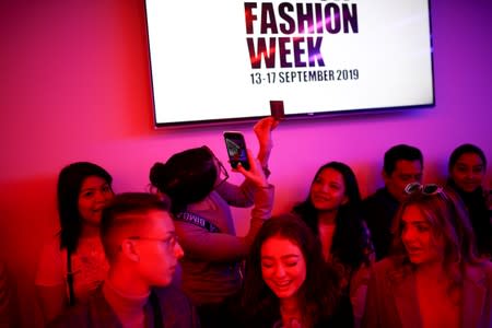 Members of the public attend the Alexa Chung public catwalk show during London Fashion Week in London