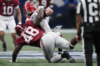 Alabama defensive lineman Phidarian Mathis (48) tackles Georgia quarterback Stetson Bennett (13) during the second half of the Southeastern Conference championship NCAA college football game, Saturday, Dec. 4, 2021, in Atlanta. (AP Photo/Brynn Anderson)