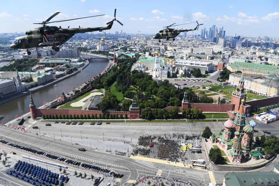 Russian army Mi-8 military helicopters fly over Red Square during the Victory Day military parade marking the 75th anniversary of the Nazi defeat in Moscow, Russia, Wednesday, June 24, 2020. The Victory Day parade normally is held on May 9, the nation's most important secular holiday, but this year it was postponed due to the coronavirus pandemic. (Alexey Maishev, Host Photo Agency via AP)