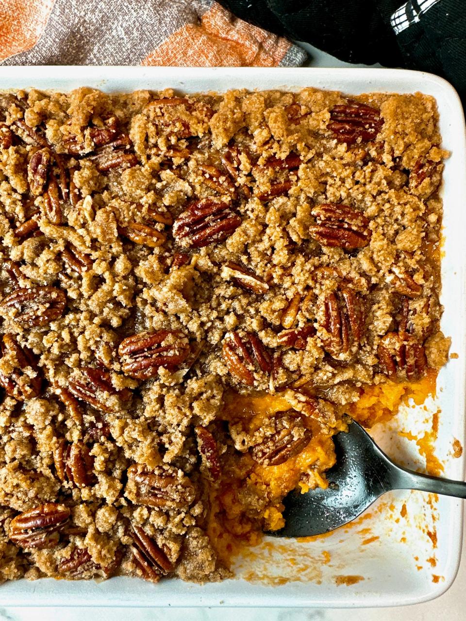 Pecan brittle topped sweet potato casserole is the ultimate holiday side dish.