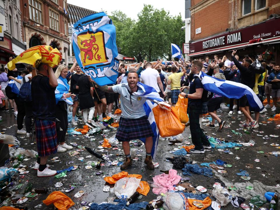 Plastic bags and drinks containers cover the ground near Leicester Square (REUTERS)