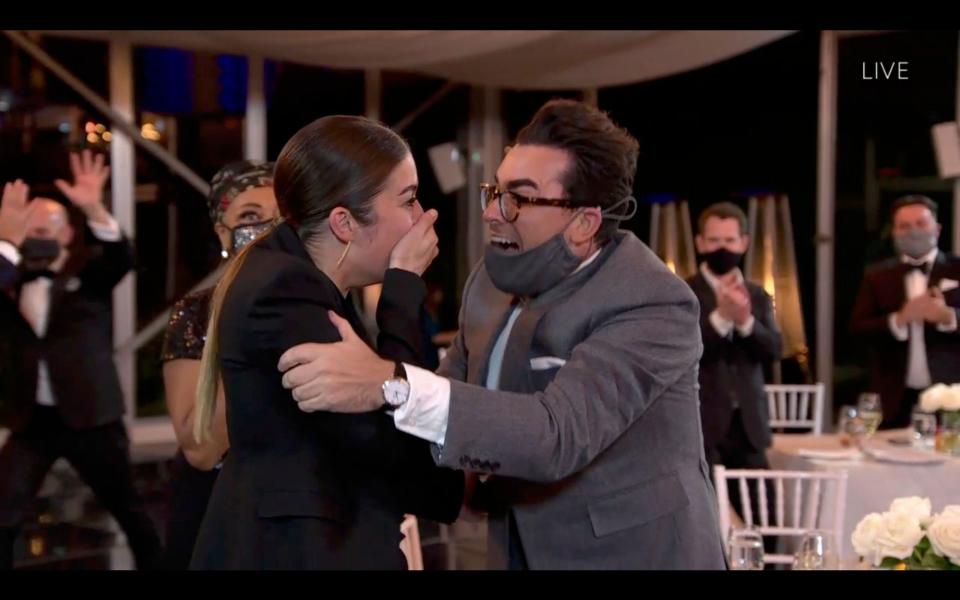 Daniel Levy, right, congratulates co-star and fellow Emmy winner Annie Murphy as the "Schitt's Creek" cast sweep the comedy category of the Emmy Awards.