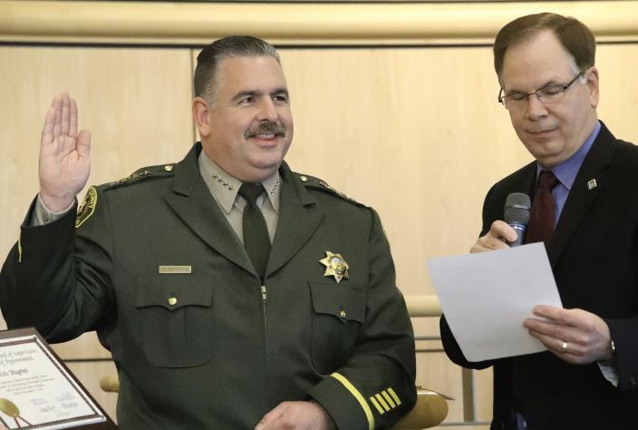 Shasta County Sheriff-Coroner Eric Magrini receives his oath from Supervisor Leonard Moty in the Board of Supervisors chambers on Tuesday, January 7, 2020.