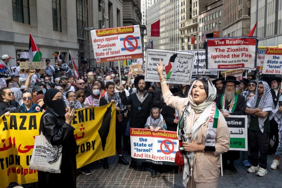 The marchers disrupted cars and prompted NYPD cops to swarm the area and begin cuffing at least two dozen of them. Aristide Economopoulos