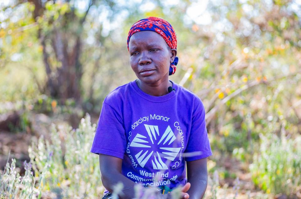 Susan, 33, spends hours daily queuing to fetch some cooking water at the only water well in her locality (ActionAid UK)