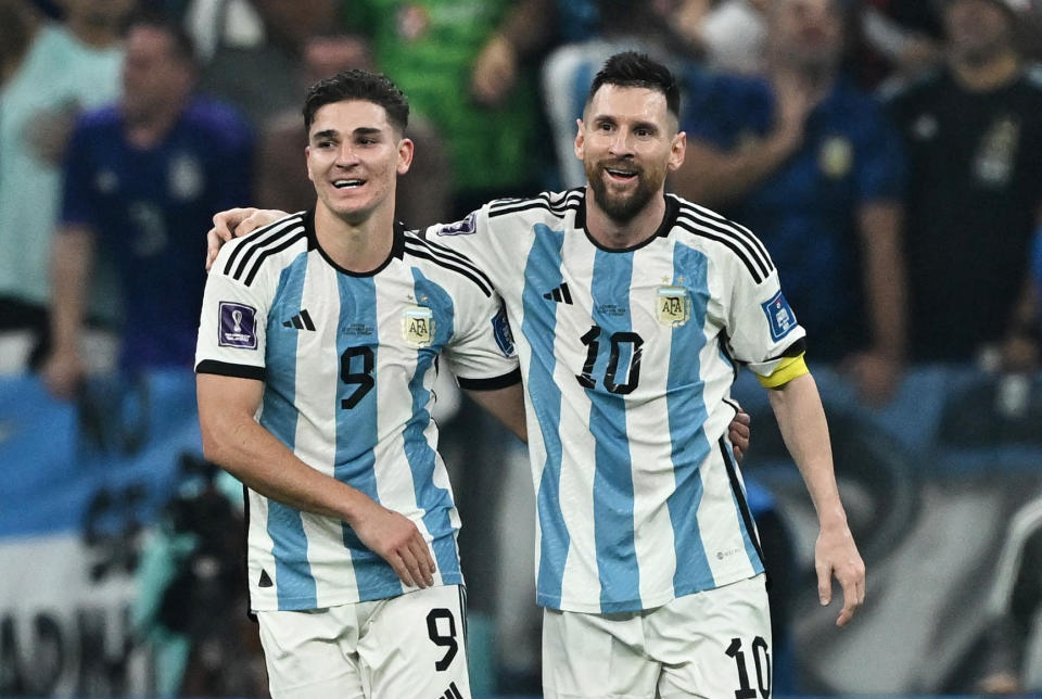 Soccer Football - FIFA World Cup Qatar 2022 - Semi Final - Argentina v Croatia - Lusail Stadium, Lusail, Qatar - December 13, 2022 Argentina's Julian Alvarez celebrates scoring their third goal with Lionel Messi REUTERS/Dylan Martinez