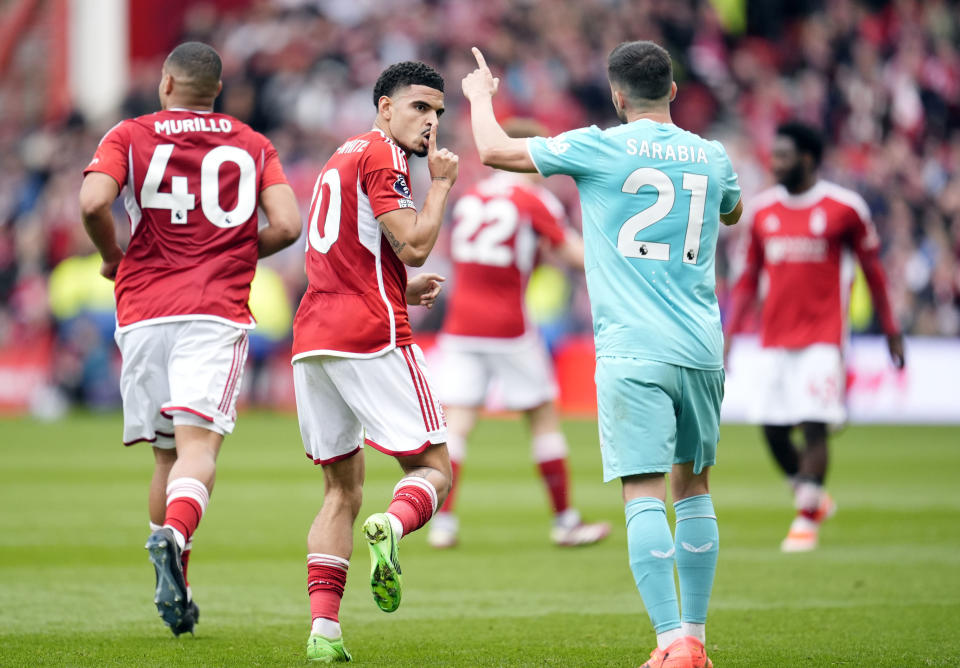 Nottingham Forest's Gibbs-White, centre, reacts after scoring his side's first goal of the game during the Premier League soccer match between Nottingham Forest and Wolverhampton Wanderers at the City Ground, in Nottingham, England, Saturday April 13, 2024. (Nick Potts/PA via AP)