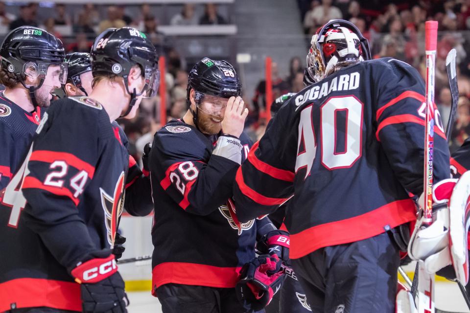 The Ottawa Senators celebrate the 1000th point scored by right wing Claude Giroux.