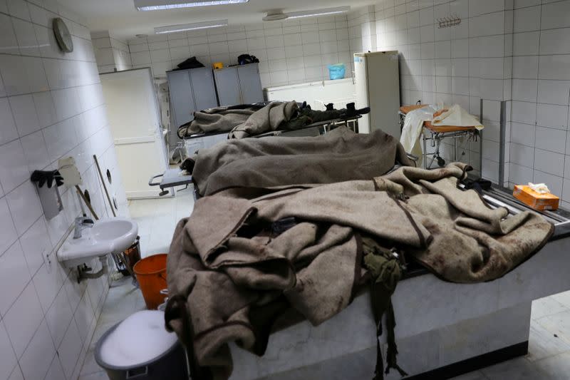 FILE PHOTO: Dead bodies are seen in a hospital following an attack on a military academy, in Tripoli