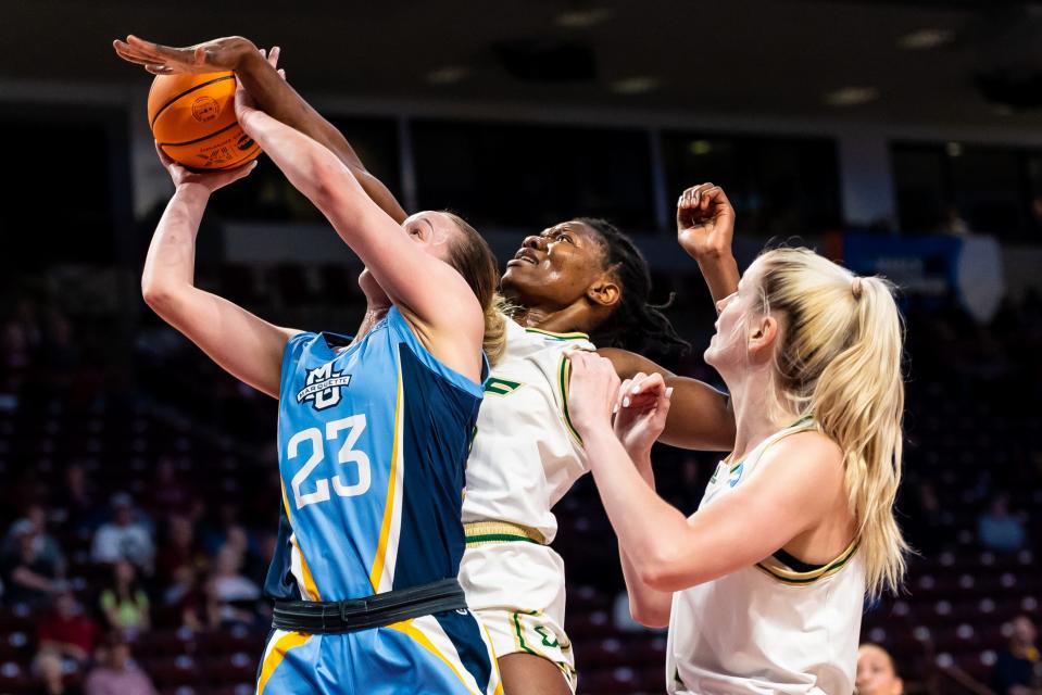 Marquette's Jordan King has her shot blocked by South Florida's Dulcy Fankam Mendjiadeu in the first half on Friday.