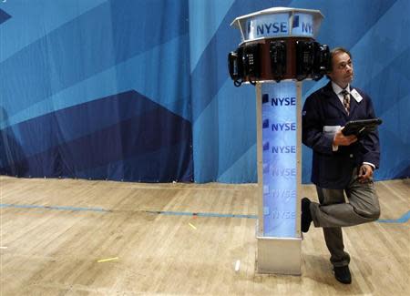 A trader works on the floor of the New York Stock Exchange in New York August 12, 2011. REUTERS/Jessica Rinaldi