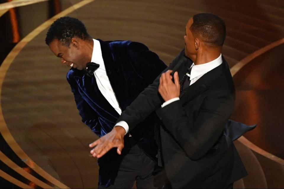 2022: Will Smith (R) slaps US actor Chris Rock onstage during the 94th Oscars at the Dolby Theatre in Hollywood, California (AFP via Getty Images)