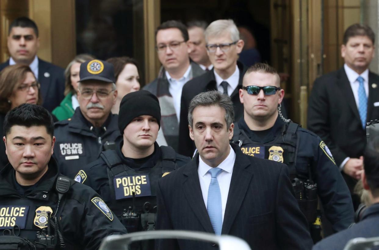 Michael Cohen exits the courthouse after his sentencing in New York