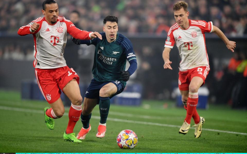 Leroy Sane and Gabriel Martinelli battle for possession.