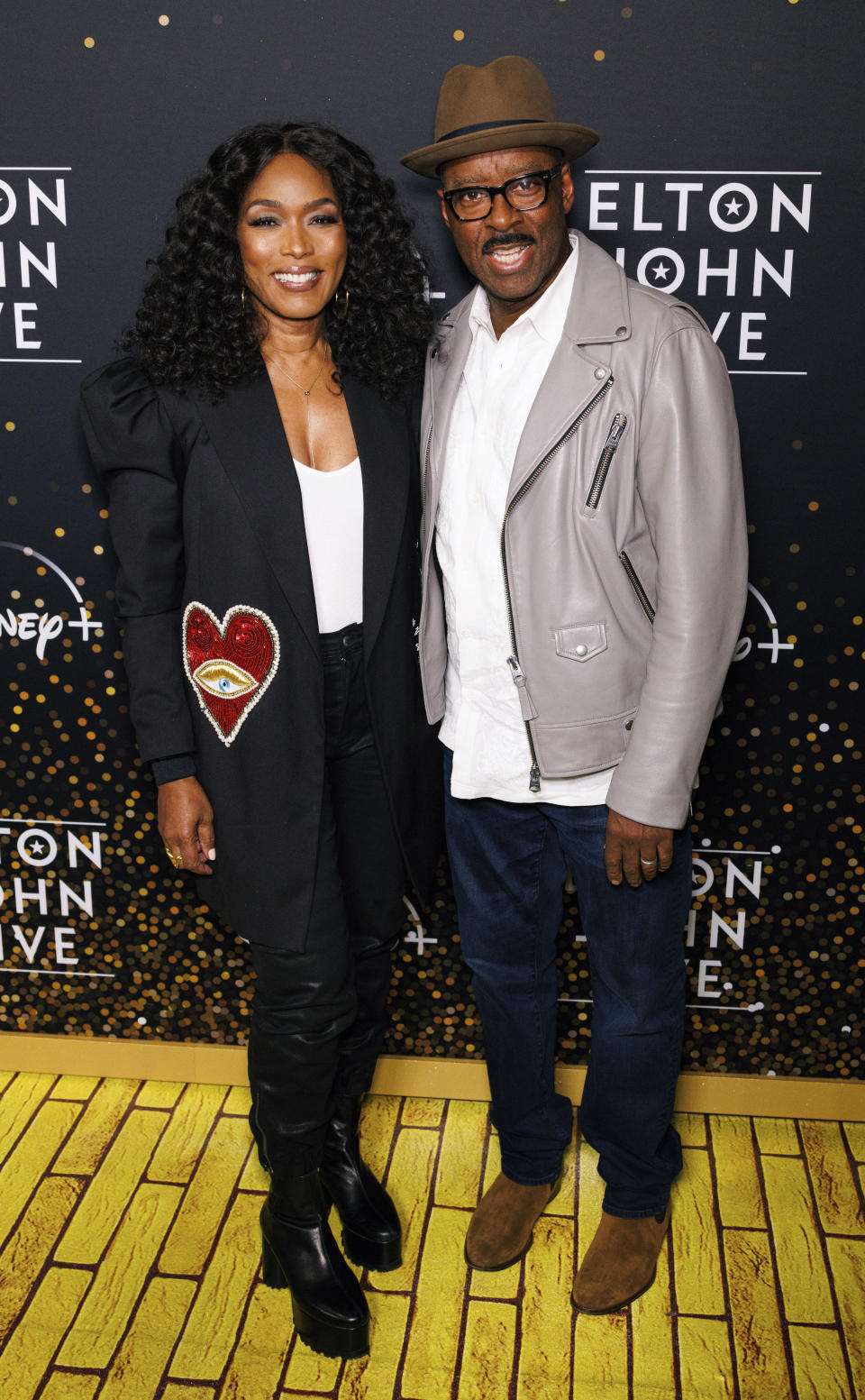 Angela Bassett, left and Courtney B. Vance arrive at Elton John's final North American show of his "Farewell Yellow Brick Road" tour on Sunday, Nov. 20, 2022, at the Dodger Stadium in Los Angeles. (Photo by Willy Sanjuan/Invision/AP)