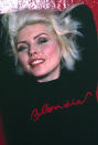 <p>Blondie’s pretty, punk frontwoman relied on muted pink and red lipsticks to balance out the metallic eyeshadow she rarely left home without. </p>