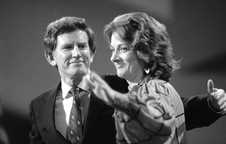 FILE - In this Wednesday, July 19, 1984 file photo, Sen. Gary Hart beams at his wife Lee as she waves at the podium following his address to the Democratic National Convention at San Francisco's Moscone Center. Lee Hart, the wife of former U.S. Sen. Gary Hart of Colorado, has died Friday, April 9, 2021 . She was 85. (AP Photo/File)