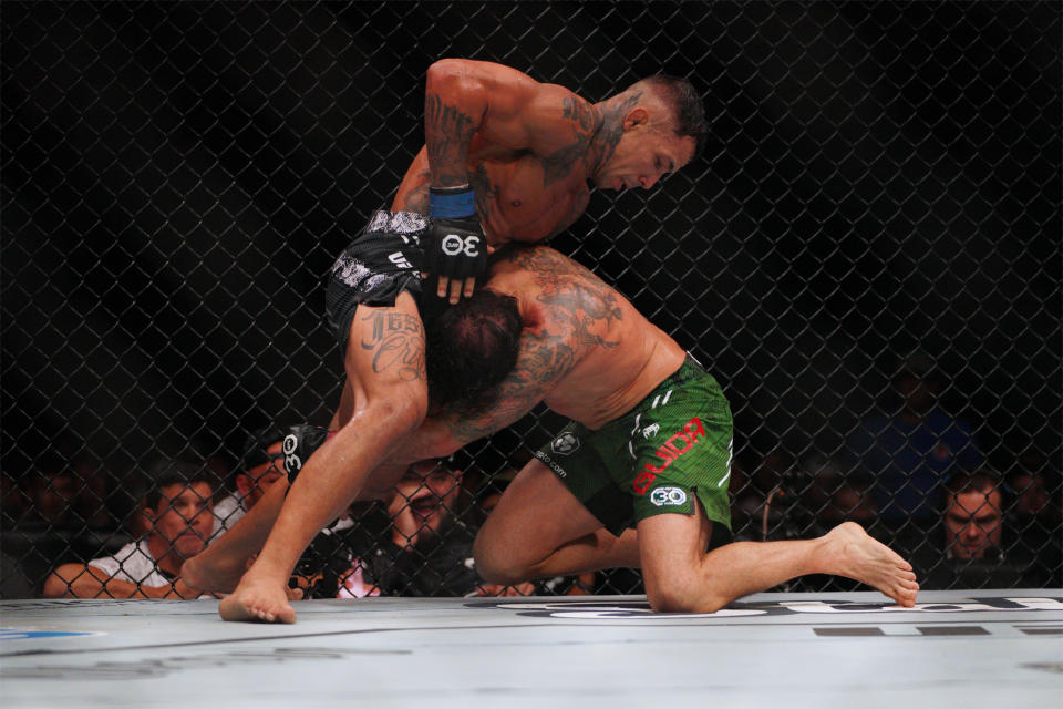 Dec 2, 2023; Austin, Texas, USA; Clay Guida (red gloves) fights Joaquim Silva (blue gloves) during UFC Fight Night at Moody Center. Mandatory Credit: Dustin Safranek-USA TODAY Sports