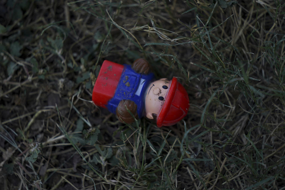 A toy covered with sand from the Rio Grande lays abandoned near the border between the cities of Del Rio, Texas, and Ciudad Acuña, Mexico, Wednesday, Sept. 22, 2021. (AP Photo/Fernando Llano)
